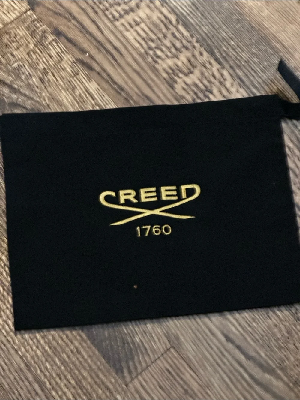 Creed Black Drawstring Pouch with Gold Logo